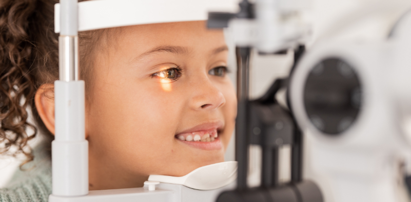 A young girl having an eye test at the opticians